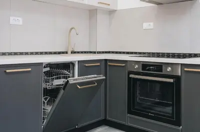 a kitchen with black appliances and a dishwasher at Top27 in Budva