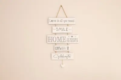 a sign that reads love is all you need smile home is where you want to at Tre canne cozy sea view apartment in Budva