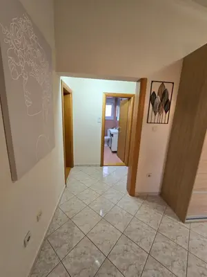 a hallway of a house with a tile floor at UnaTea Suites in Bar