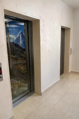 a room with a large glass door with a view at Apartment Jana Meerblick mit Balkon nähe Sandstrand in Becici