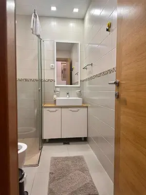 a bathroom with a shower and a sink and a mirror at Posto Capitano apartment Sasa in Kotor