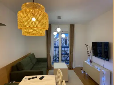 a living room with a couch and a table at Cozy one bedroom apartment in Podgorica