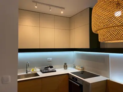 a kitchen with a sink and a stove top oven at Cozy one bedroom apartment in Podgorica