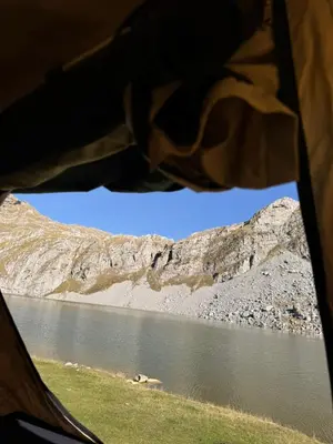 a view of a lake from inside a tent at Escape Montenegro Campervan Durmitor in Podgorica