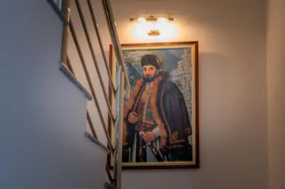 a painting of a man in armor hanging on a wall at Apartmani Barović Bečići in Becici