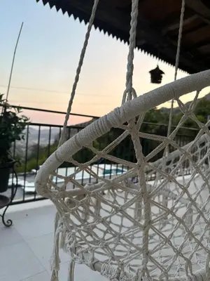 a rope swing with a view of the ocean at Etno House Mali Grm in Bar