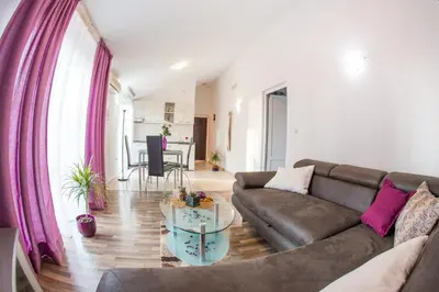 a living room with a couch and a table at Villa Nadezda in Petrovac na Moru