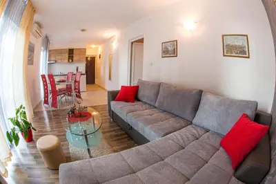 a living room with a couch and a table at Villa Nadezda in Petrovac na Moru