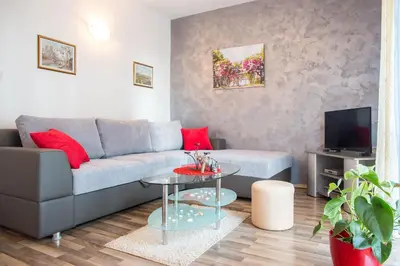 a living room with a couch and a table at Villa Nadezda in Petrovac na Moru