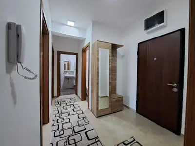 a hallway with a bathroom with a toilet and a door at Gruda 086 in Cetinje
