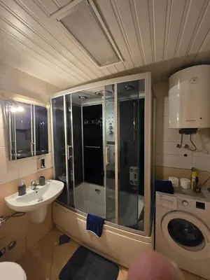 a bathroom with a shower and a sink at Jednosoban apartman Anara Prijevor in Budva