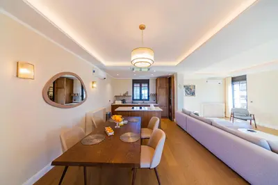 a living room with a table and a couch at Villa Seaside Shore in Budva