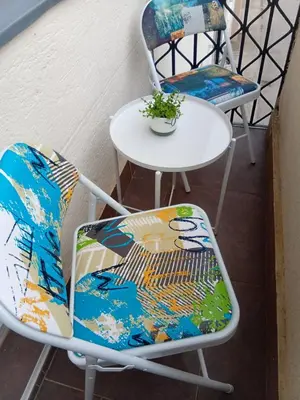 two chairs and a table and a table and chairs at Bella Studio in Podgorica