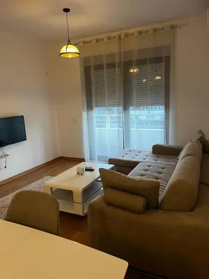 a living room with a couch and a table at Amore in Ulcinj