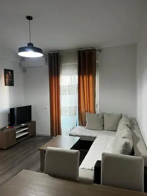 a living room with a couch and a table at Amore in Ulcinj