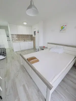 a large white room with a large bed in it at Luka MonteVilla in Bar