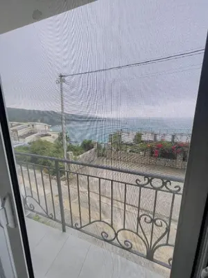 a view of the ocean from a balcony at Luka MonteVilla in Bar