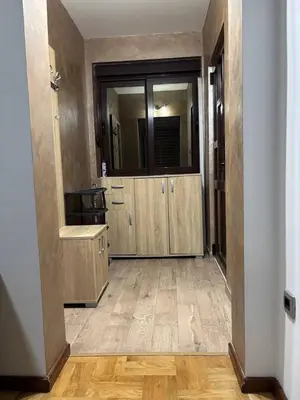 an empty room with a bathroom with a mirror at Apartment Laura in Budva
