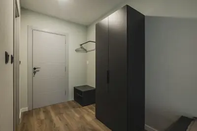 a room with a black closet and a door at Moon apartment 1 in Podgorica