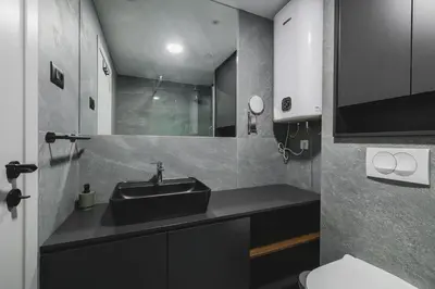 a bathroom with a sink and a toilet at Moon apartment 1 in Podgorica