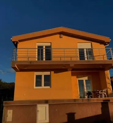 a building with a balcony on top of it at Spacious Home with Stunning Mountain and Sea Views , Bar, Dobre Vode Montenegro in Bar
