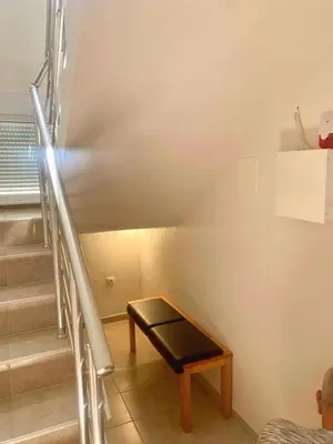 a stairway with a bench next to a set of stairs at Spacious Home with Stunning Mountain and Sea Views , Bar, Dobre Vode Montenegro in Bar