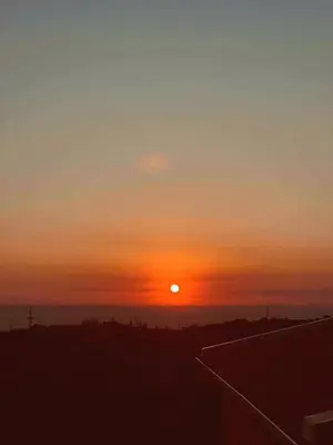 a sunset over the ocean with the sun in the sky at Spacious Home with Stunning Mountain and Sea Views , Bar, Dobre Vode Montenegro in Bar