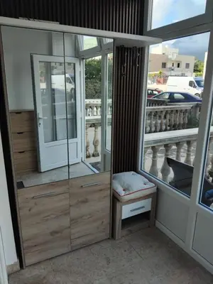 a room with a glass door and a window at AK apartman in Sutomore