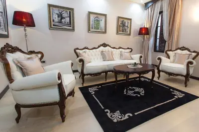 a living room with two chairs and a table at Pearl Apartments in Kotor
