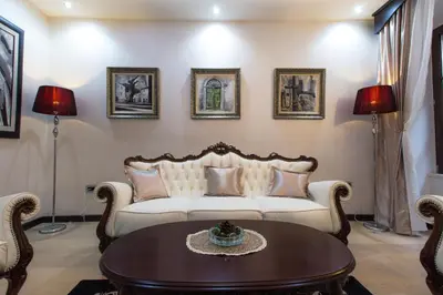 a living room with a couch and a table at Pearl Apartments in Kotor