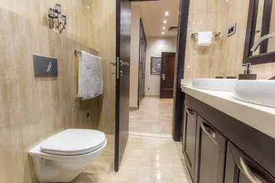 a bathroom with a toilet and a sink at Pearl Apartments in Kotor