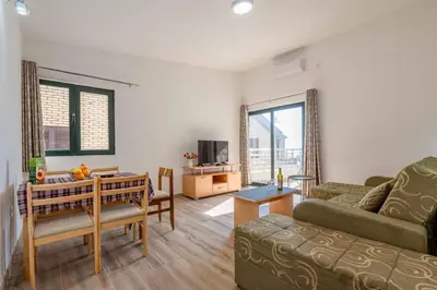 a living room with a couch and a table at Apartmani Sonja i Branko in Sutomore