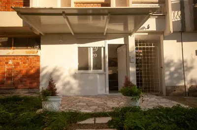 a front door of a white house with a porch at CENTAR Apartmant in Bar