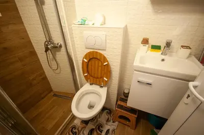 a small bathroom with a toilet and a sink at CENTAR Apartmant in Bar