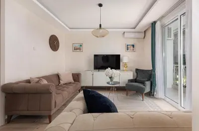 a living room with a couch and a tv at Petrovic Family - Two Bedroom Apartment in Kotor