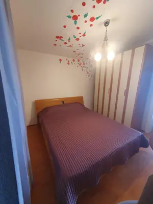 a bedroom with a bed with colorful confetti on the ceiling at Traumhafte Wohnung mit Meerblick in Sutomore in Sutomore
