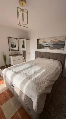 a bedroom with a large bed in a room at GreenHouse in Bar