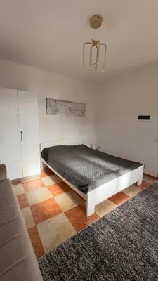 a bed sitting in a room with at GreenHouse in Bar