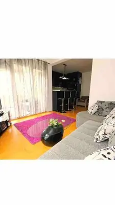 a living room with a computer mouse on the floor at Izvor in Budva