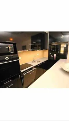 a kitchen with a sink and a stove top oven at Izvor in Budva