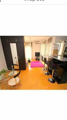 a living room with chairs and a table in a room at Izvor in Budva