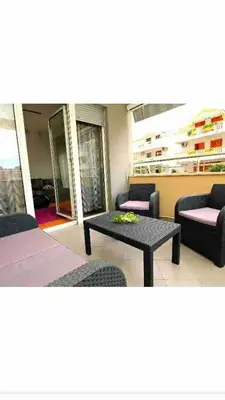 a living room with a couch and a table at Izvor in Budva