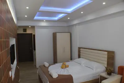 a bedroom with a bed with two pumpkins on it at Casa Hena in Ulcinj