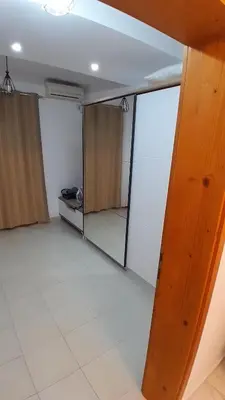 a room with glass doors and a white tile floor at Linda Apartments in Ulcinj