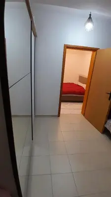 a room with a door leading to a bedroom at Linda Apartments in Ulcinj