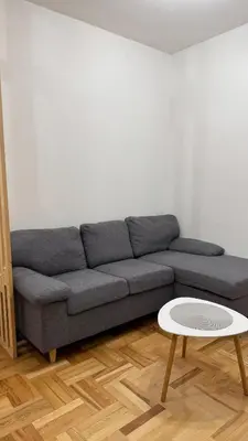 a living room with a couch and a table at Podgorica apartment - up to 4 persons in Podgorica