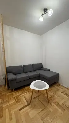 a living room with a couch and a table at Podgorica apartment - up to 4 persons in Podgorica