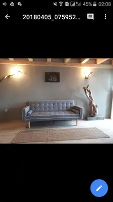 a bench sitting in a room with a statue at Sunview Sveti Stefan in Sveti Stefan