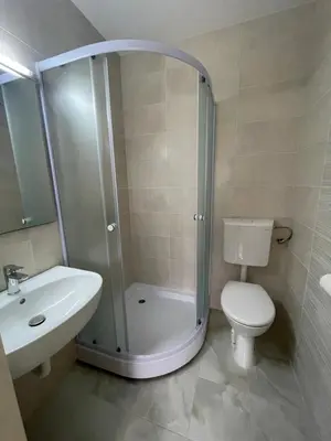 a bathroom with a shower and a toilet and a sink at Casa Verde in Boreti