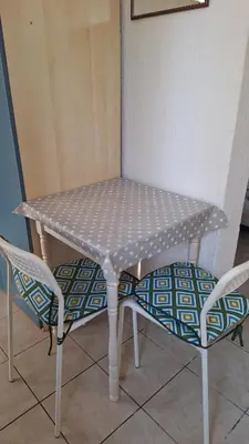 a table and two chairs sitting next to a table at Studio Apartman Kamenovo in Pržno